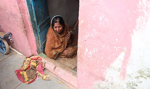 A relative of one of the children who died in a house wall collapse is seen crying in Babul Reddy Nagar in Rangareddy district on Monday.