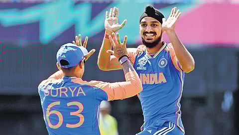 India’s Arshdeep Singh (R) took 4/9 against United States on Wednesday