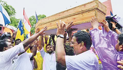 Representatives of Kerala Latin Catholic Association (KLCA) hold a march carrying a coffin to protest against the delay in addressing the issues of Muthalappozhi harbour.