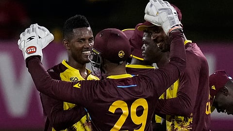 West Indies' Akeal Hosein, left, celebrates with teammates after their 134-run victory over Uganda during an ICC Men's T20 World Cup cricket match on Saturday, June 8, 2024.