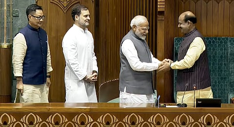 Prime Minister Narendra Modi greets Om Birla after the latter was elected as the Speaker of the House during the first session of the 18th Lok Sabha, in New Delhi, Wednesday, June 26, 2024. Leader of the Opposition Rahul Gandhi and Union Minister for Parliamentary Affairs Kiren Rijiju are also seen.