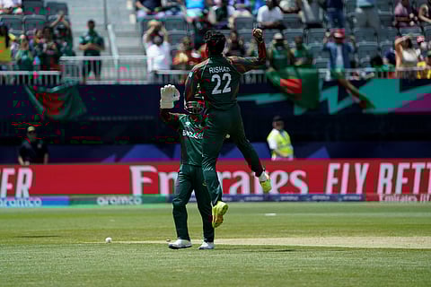 Bangladesh's Rishad Hossain celebrates after taking a wicket