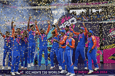 India players celebrate with the World Cup trophy after defeating South Africa in the ICC Men's T20 World Cup final cricket match at Kensington Oval in Bridgetown, Barbados, Saturday, June 29, 2024.