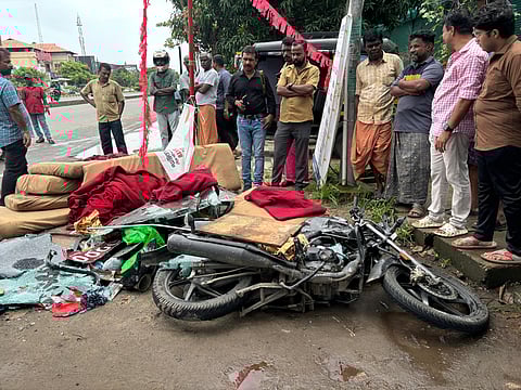 A motorist was killed after a private bus overturned and fell on him near Kochi