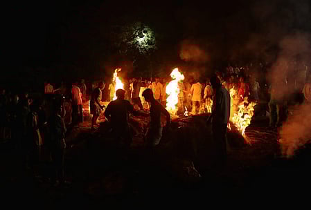 Mass cremation of Kallakurichi hooch tragedy victims at Karunapuram, in Kallakurichi, Thursday.