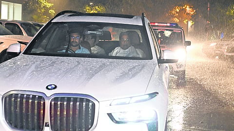 Chief Minister Siddaramaiah arrives for the Congress Legislature Party meeting amid heavy rain in Bengaluru on Sunday