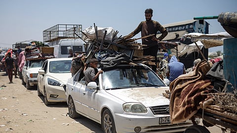 Palestinians arrive in the southern Gaza town of Khan Younis after fleeing an Israeli ground and air offensive in the nearby city of Rafah on Friday, June 28, 2024.