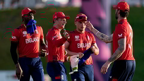 England's captain Jos Buttler, second left, celebrates with teammates winning an ICC Men's T20 World Cup cricket match against Namibia at Siv Vivian Richards Stadium in North Sound, Antigua and Barbuda, Saturday, June 15, 2024.