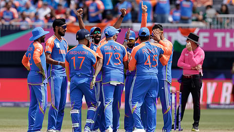 Indian players celebrate the dismissal of Pakistans Usman Khan during the ICC Mens T20 World Cup cricket match between India and Pakistan at the Nassau County International Cricket Stadium in Westbury, New York.