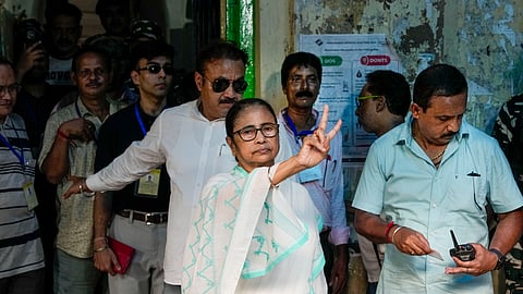 West Bengal Chief Minister and TMC Supremo Mamata Banerjee shows victory sign after casting her vote for the seventh and last phase of Lok Sabha elections at a polling station, in Kolkata.