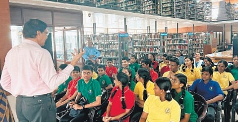 The library secretary K P Ajith Kumar led an interactive session with students, explaining the functioning of a library, how to get a membership.