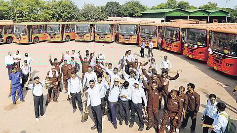 Cluster buses parked in a depot.