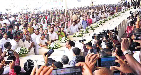 Chief Minister Pinarayi Vijayan paying tributes to the victims of Kuwait fire tragedy after the bodies were brought to Kochi airport on Friday