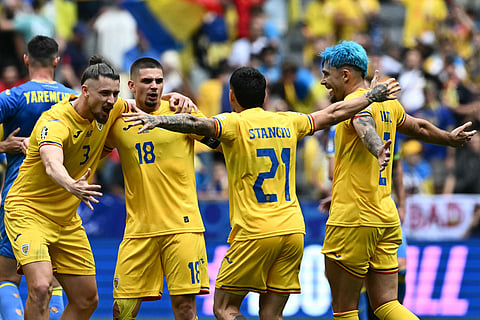 Ukraine football team players celebrating after scoring a goal