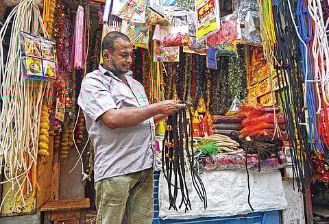 A vendor sells accessories for goats ahead of Bakrid in Shivajinagar