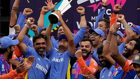 Rahul Dravid, centre left, lifts the T20 World Cup trophy after India defeated South Africa in the ICC Men's T20 World Cup final