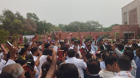 The Opposition leaders protest holding the Constitution of India.