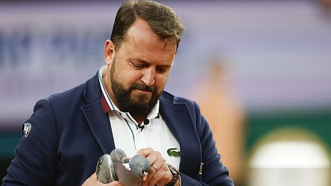 Love All! Chair umpire Damien Dumusois of France holds a pigeon that crashed onto the court during the third round match of the French Open tennis tournament between Tomas Machac and Daniil Medvedev at the Roland Garros stadium in Paris, Saturday, June 1, 2024.
