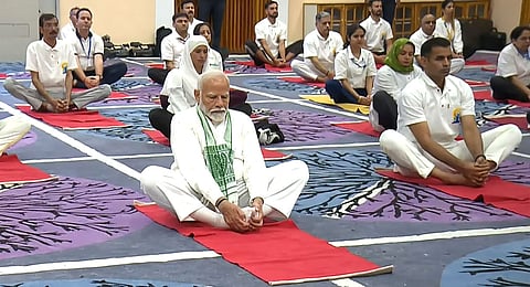 Prime Minister Narendra Modi performs yoga during celebration on the 10th International Day of Yoga, in Srinagar, Friday, June 21, 2024