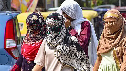 Representative image of people walking through the heat