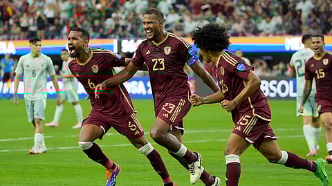 Venezuela's Salomon Rondon, centre, celebrates scoring his side's opening goal from the penalty spot during Copa America.