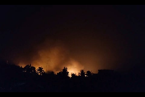 In this photo taken from video, provided by a displaced Rohingya, the scarlet flames that came out from the burning of the houses in the town of Buthidaung in Rakhine state, Myanmar, are seen from a distance on May.17, 2024.