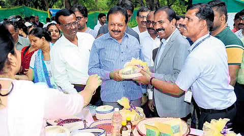 Karnataka Agriculture Minister N Chaluvarayaswamy at a stall at
‘Product Santhe’ at GKVK Campus, in Bengaluru on Saturday