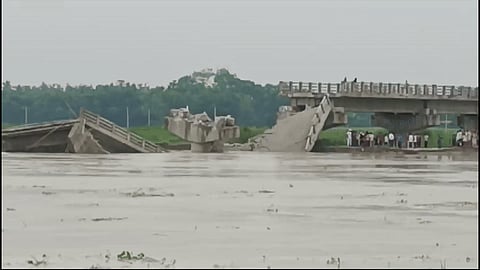 A portion of newly constructed bridge over Bakra River collapses in Bihar's Araria district recently.