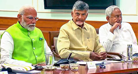 Prime Minister Narendra Modi with key allies TDP chief N Chandrababu Naidu and JD(U) chief Nitish Kumar during National Democratic Alliance (NDA) meeting at 7, Lok Kalyan Marg, in New Delhi, Wednesday, June 5, 2024.