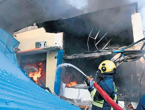 Fire service personnel trying to douse the fire after an explosion at a paint factory in Kakkalur industrial estate.