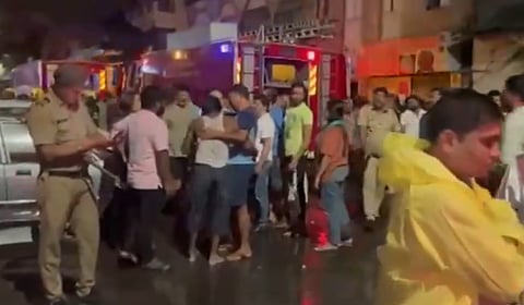 Fire department officials carry out rescue operations following a fire at a girl's PG accommodation in the Shanipar area of Pune City in the wee hours of Friday.