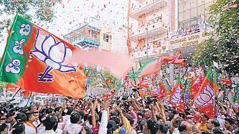 The BJP office wears a festive look, with supporters waving party flags and cheering, after the announcement of results of the Lok Sabha polls.