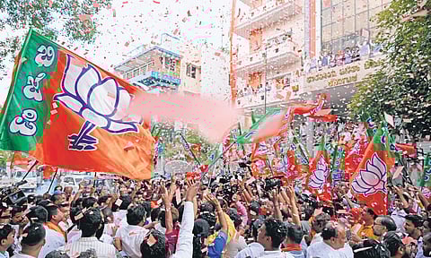 The BJP office wears a festive look, with supporters waving party flags and cheering, after the announcement of results of the Lok Sabha polls, in Bengaluru on Tuesday