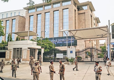Police personnel outside the Rouse Avenue Court on Wednesday before Delhi CM Arvind Kejriwal was produced before the court and arrested by CBI in an excise scam case.