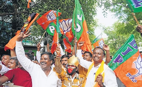 BJP supporters celebrate the victory of Bangalore Central candidate PC Mohan in Bengaluru on Tuesday