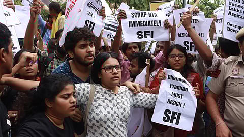 Members of Students Federation of India and other students union stage a protest over NEET-UG and UGC-NET issues outside Shastri Bhawan, in New Delhi