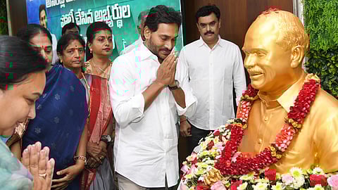 YSRC chief Jagan Mohan Reddy pays floral tributes to the statue of YS Rajasekhara Reddy.
