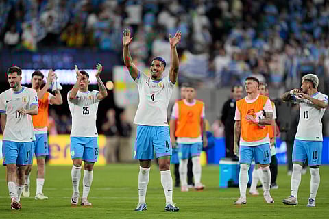 Uruguay's Ronald Araujo, center, and teammates celebrate their team's 5-0 victory over Bolivia at the end of a Copa America Group C soccer match in East Rutherford, N.J., Thursday, June 27, 2024.