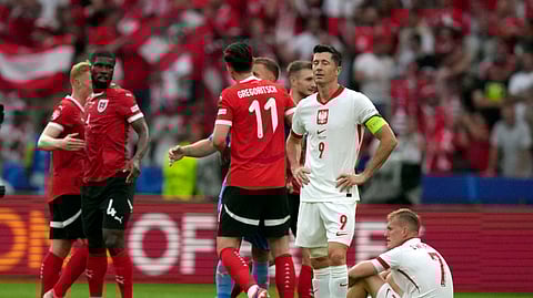 Poland's Robert Lewandowski (9) reacts after during a Group D match between Poland and Austria at the Euro 2024 soccer tournament in Berlin, Germany, Friday, June 21, 2024.