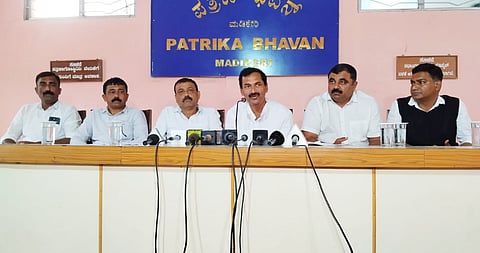 Karnataka Congress leader M Lakshmana speaking to reporters in Madikeri.