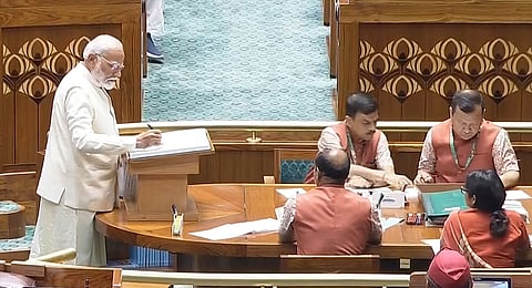 Prime Minister Narendra Modi signs a register after taking oath as a member of the House during the first day of the first session of the newly-constituted 18th Lok Sabha, in New Delhi, Monday, June 24, 2024.