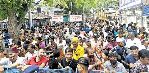 People from various states gather at the Nampally Exhibition Grounds in Hyderabad on Saturday to receive the traditional fish medicine