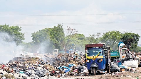 Smoke emanates from burning garbage at the Deepthisri Nagar transfer station in Miyapur on Thursday