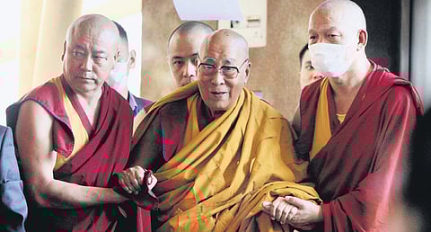 Dalai Lama arrives for a prayer at the Main Tibetan Temple in Dharamsala
