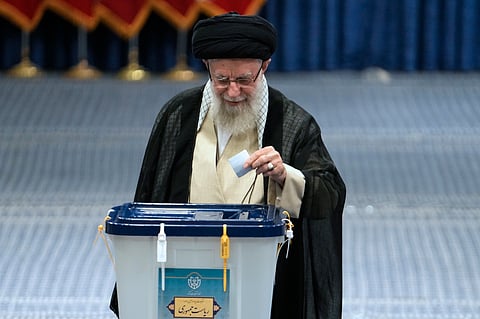 Iranian Supreme Leader Ayatollah Ali Khamenei casts his ballot during the presidential election, in Tehran, Iran, Friday, June 28, 2024.