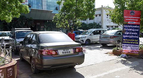 Large number of four-wheelers parked in front of the main building at MGMGH in Tiruchy