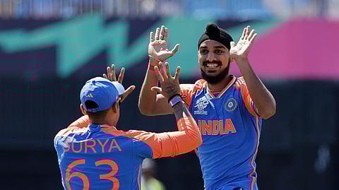 Arshdeep Singh, right, celebrates with teammate Suryakumar Yadav after the dismissal of US' Shayan Jahangir during the ICC Men's T20 WC cricket match between United States and India at the Nassau County International Cricket Stadium in Westbury, New York, Wednesday, June 12, 2024.
