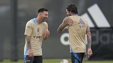 Lionel Messi, left, laughs with Rodrigo De Paul as members of Argentina's soccer team train ahead of the Copa America soccer tournament, Wednesday, June 5, 2024.