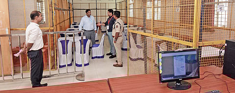 Deputy Commissioner K V Rajendra inspects a counting centre at Maharani’s College in Mysuru on Monday