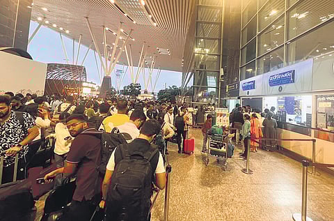 Air passengers wait to get refunds from IndiGo at Terminal 1 of KIA on Friday